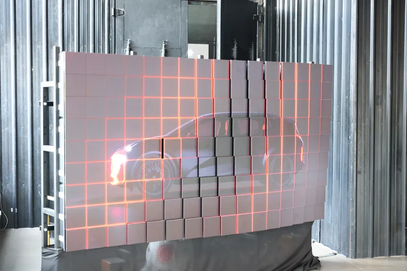 Kinetic LED tile wall lit with a red ZEEKR X outline at the launch venue, Odeum, JioSpace