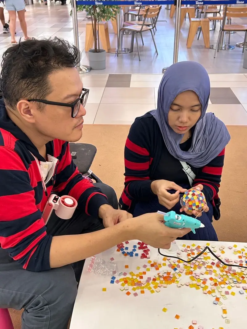 Mosaic wind chimes at MyTown Raya · March 2026 — photo 4