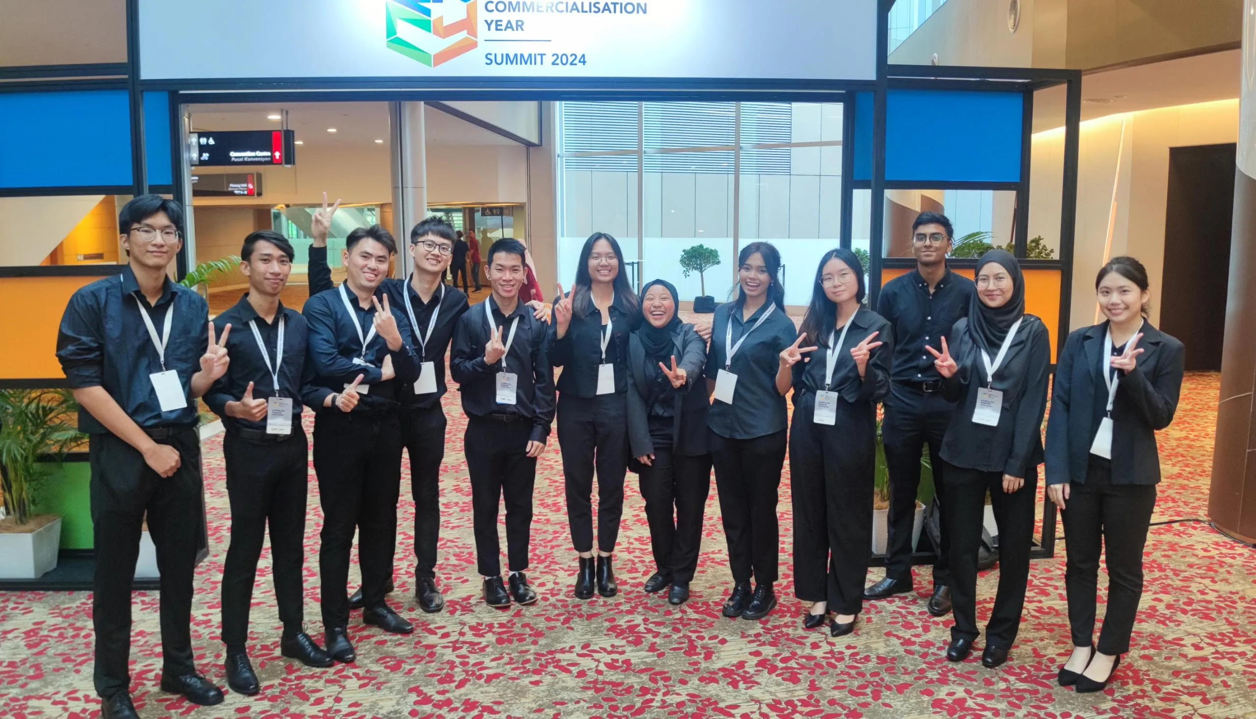 Uniformed Baito event crew at a KLCC summit