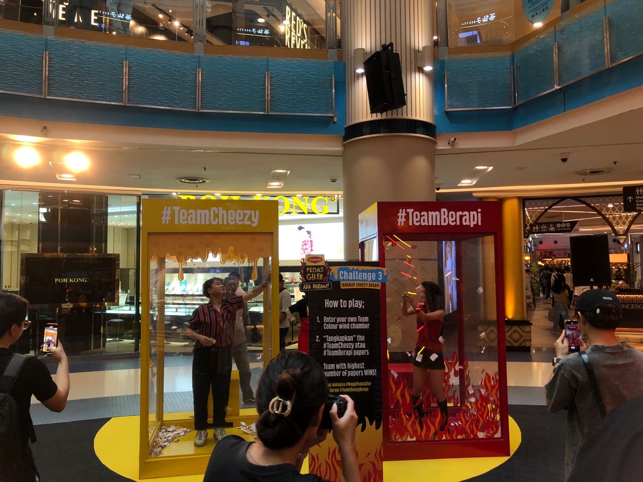 Two branded wind chamber booths in a shopping mall